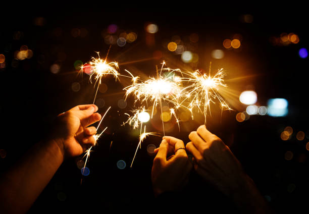 istock Celebrating with sparklers in the night 985032678