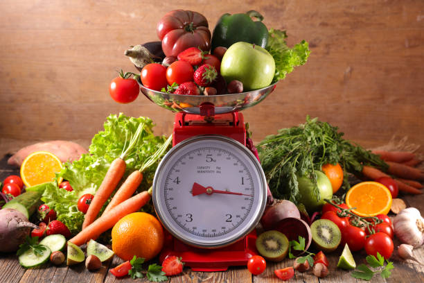 istock balance with fruit and vegetable, diet food concept 985033434