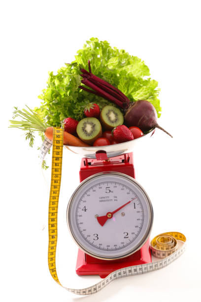 istock balance with fruit and vegetable, diet food concept 985033486