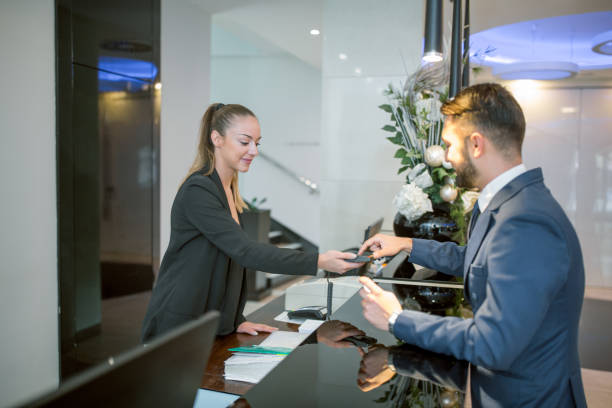 istock Receptionist and businessman 985033622
