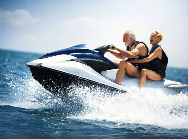 jet skiing. - nautical vessel motorboating motorboat fun imagens e fotografias de stock