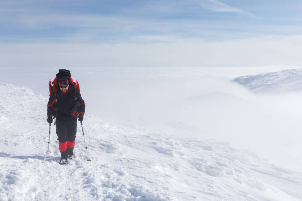 istock A hiker in the winter mountains 985038386