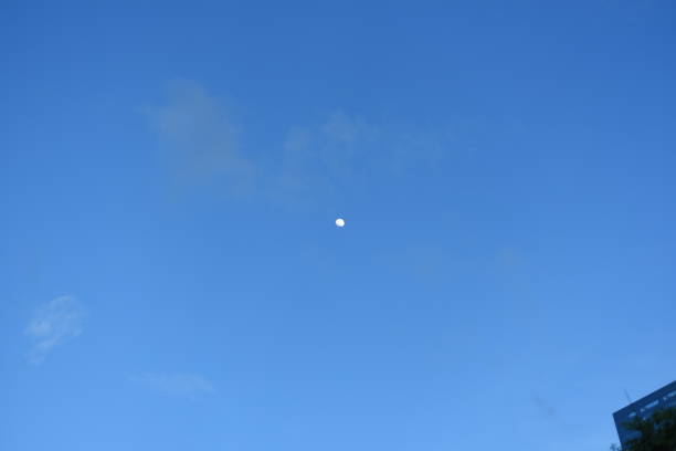 istock The moon alone in the clear sky (dusk) 985038706