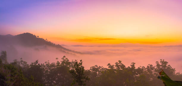istock scenery sunrise above the mist 985042252