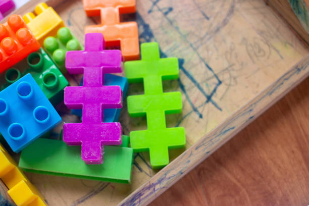 istock Toy colorful plastic blocks on wooden floor background 985046826