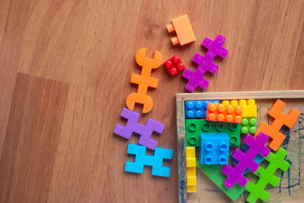 istock Toy colorful plastic blocks on wooden floor background 985046892