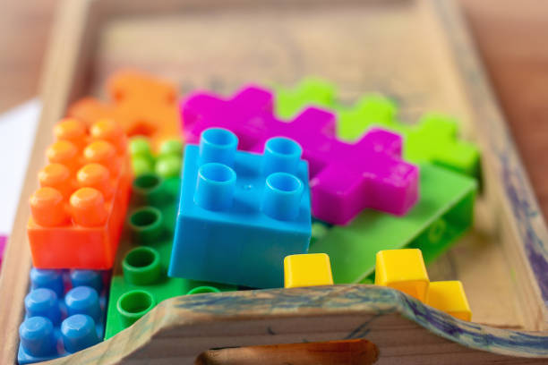 istock Toy colorful plastic blocks on wooden floor background 985046934