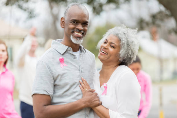 istock Attractive couple attend cancer fundraiser 985048520