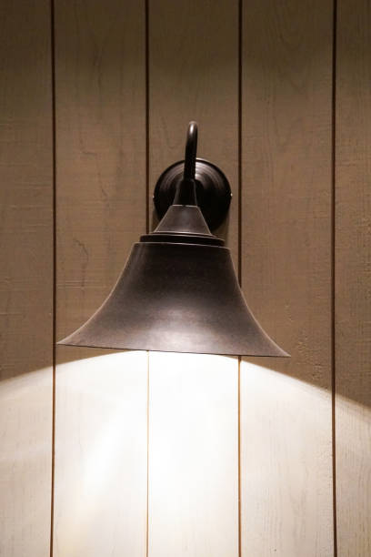 istock old antique vintage indoor lamp light on wooden wall 985051020