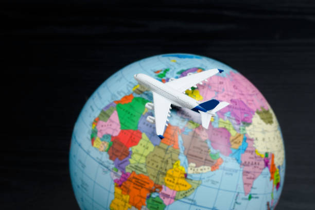 istock Airplane on the globe. Travel concept. 985051152