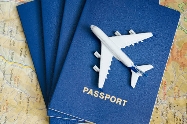 istock Airplane on the passports. Close up 985051184