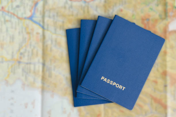 istock Four blue passport on a map. Travel Concept 985051192