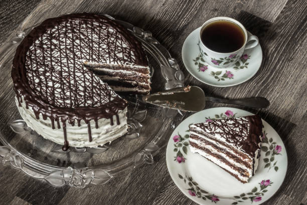 istock Delicious chocolate cake with creamy cream with coffee 985054114