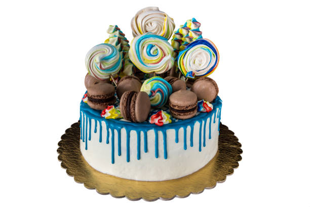 istock cake with meringue (kisses) and macaroons isolated on white background 985056566