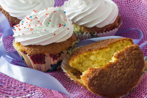 Split biscuit muffin on background of a delicious muffins with protein cream