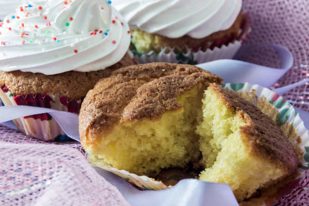 Split biscuit muffin on background of a delicious muffins with protein cream