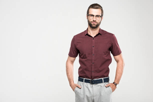 istock serious man posing in casual closing and eyeglasses, isolated on grey 985057270