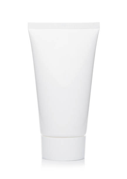 istock Plastic container of skin cream on white 985057384