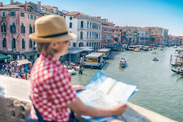 istock Tourist woman with map in Venice 985057772