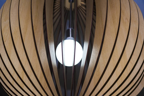 istock Decorative white lamp in wooden dome. 985058098