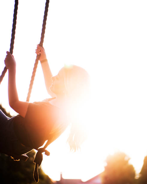 istock Young Woman Swinging 985059168