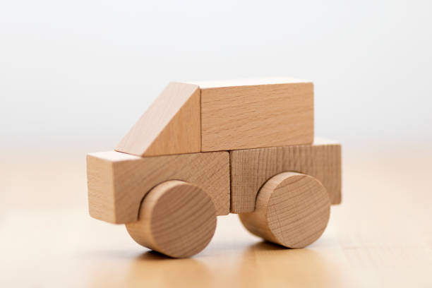 istock Small wooden toy car 985061360