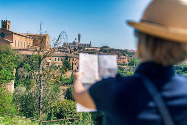 istock Tourist man with map in Siena - Italy 985067756