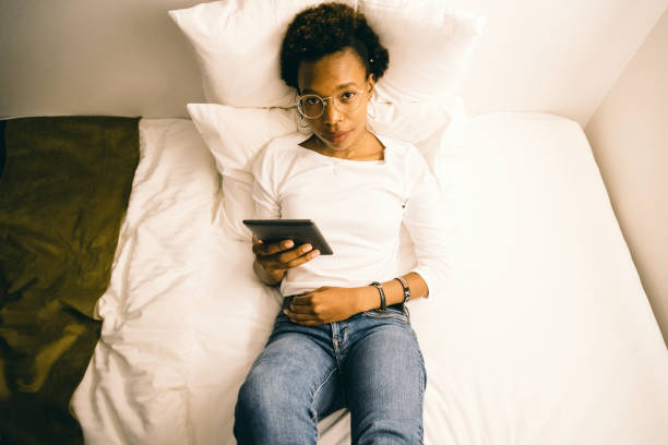 istock Young woman who is relaxed on a bed 985069896