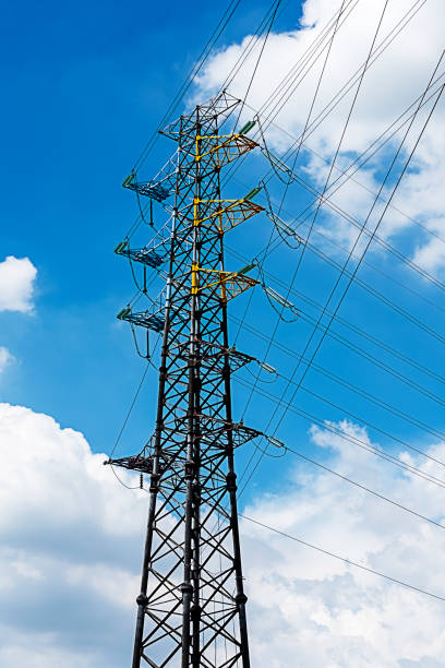istock The electrical transmission tower with the blue sky and white clouds in the summer 985073938