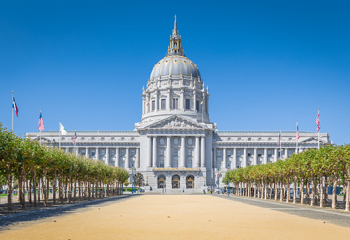 Classic view of historic San Francisco City Hall, the seat of government for the City and County of San Francisco, California, on a beautiful sunny day with blue sky in summer, USA