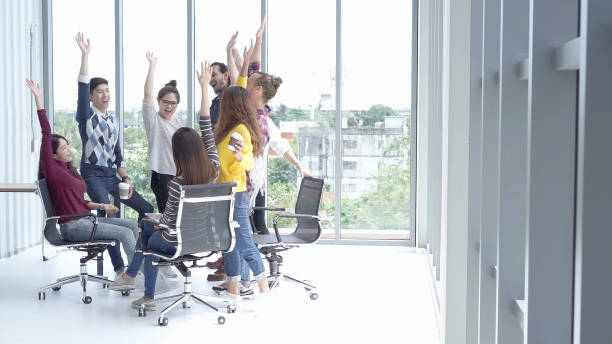 istock Happy Multi Ethnic Creative raise hands together at the office,Multi Ethnic and success Teamwork Concept 985079842