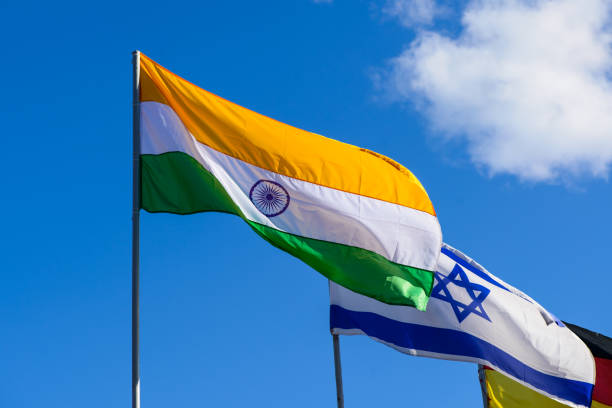 istock International summit. Flags of different countries blowing in th 985083624