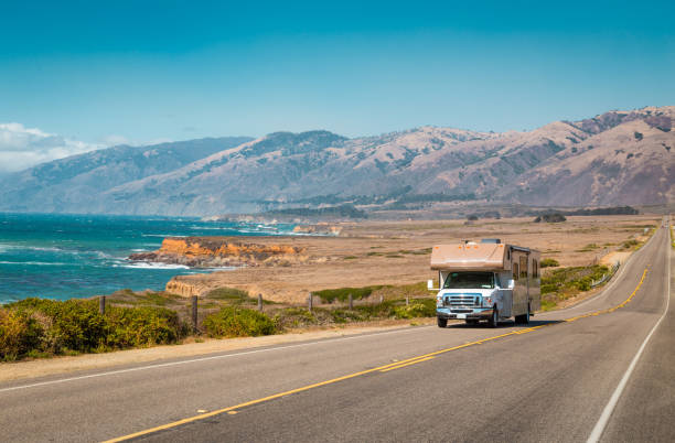 Recreational vehicle on Highway 1, California, USA Panorama view of recreational vehicle driving on famous Highway 1 along the beautiful Central Coast of California, Big Sur, USA big sur stock pictures, royalty-free photos & images