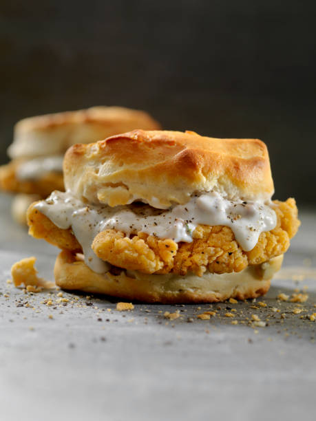 istock Fried Chicken Sandwich with Sausage Gravy on a Biscuit 985087852