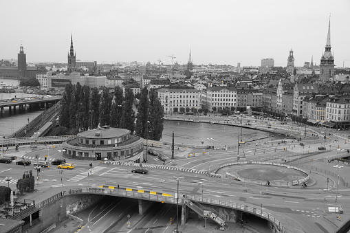 View of the square in Stockholm, black and white with a yellow highlight.