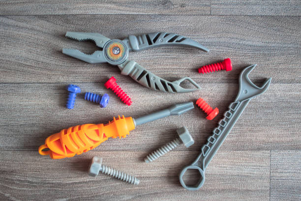 istock Toy tools on the background of gray boards 985088344