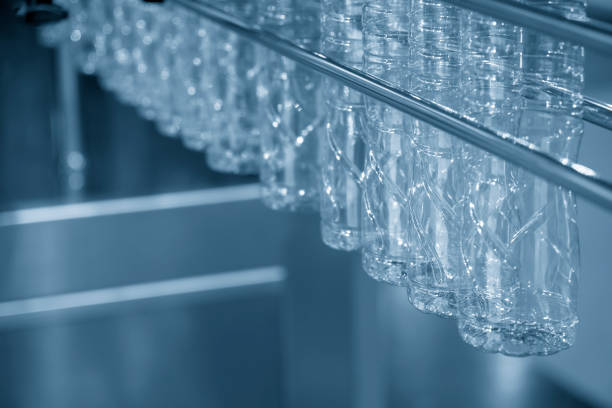 istock The new plastic bottles hanging in the conveyor belt 985090854