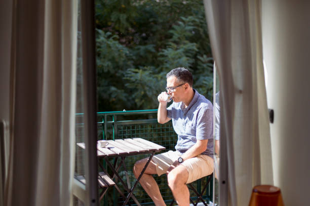 istock A man drinking an espresso on a balcony, Italy 985091446