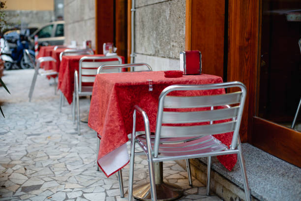 istock Row of restaurant table on a sidewalk 985091494