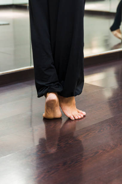 istock Ballerina dancing, closeup on legs and shoes. 985096448