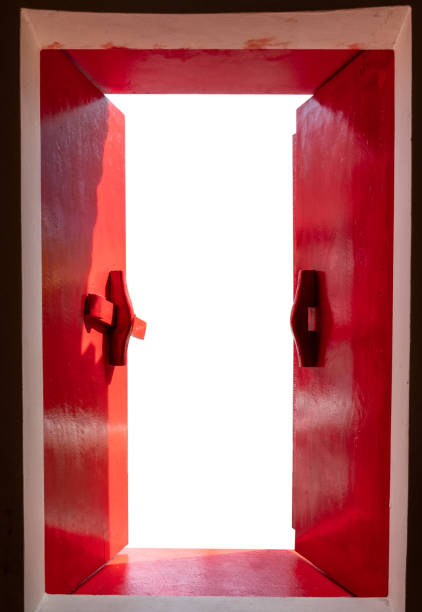 istock Red wooden windows opened with sunshine on white background 985100328