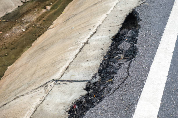 istock Cracked and broken of surface asphalt road 985100338