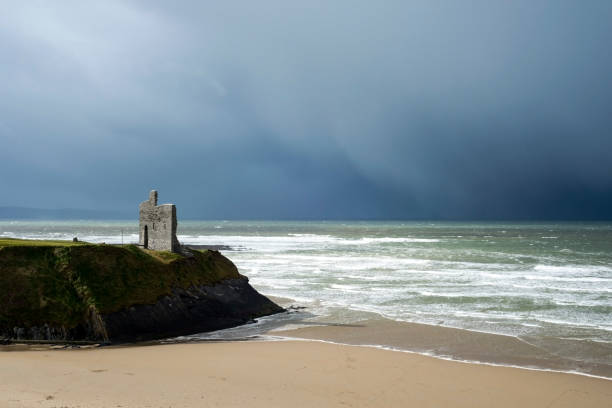 winter rain storm approaching castle stock photo