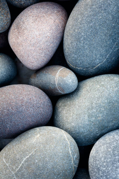 istock abstract background with round pebble stones in vintage retro stile. stones beach smooth 985114760