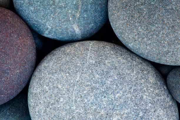 abstract background with round pebble stones in vintage retro stile. stones beach smooth - oman beach nature stone imagens e fotografias de stock