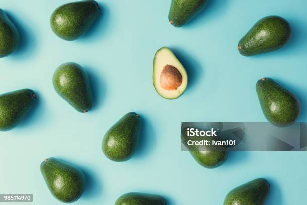 Avocado Colorful Pattern On A Pastel Blue Background Summer Concept Flat Lay Stock Photo - Download Image Now