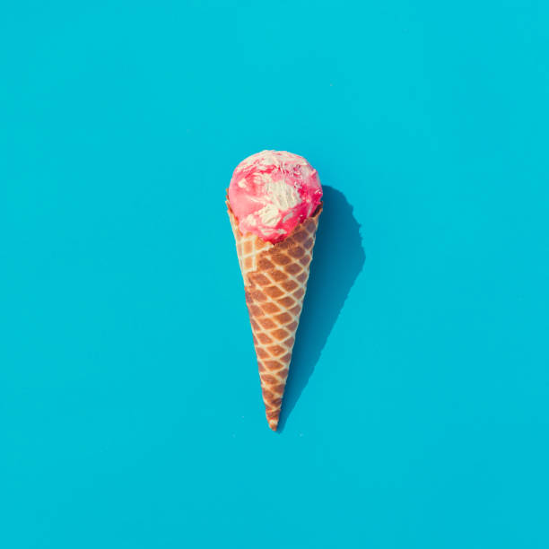 istock Pink and white ice cream on pastel blue background. Summer minimalism. Flat lay. 985115538