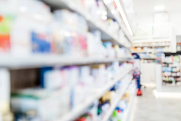 istock Pharmacy drugstore shop interior blur background 985126016