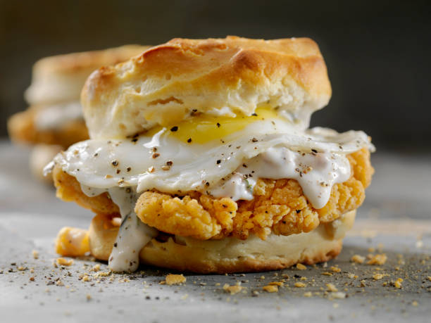 istock Fried Chicken Sandwich with a Fried Egg,Sausage Gravy on a Biscuit 985130070