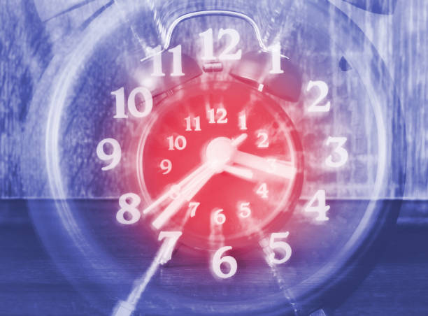 istock Concept of time passing on a analog clock with blurred zoom effect 985132826